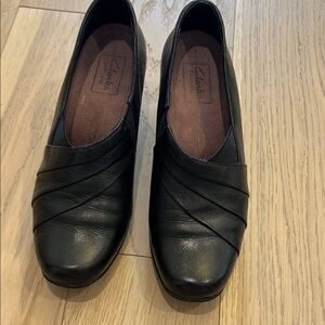 Clarks Black Leather Flats with Slip-On Design